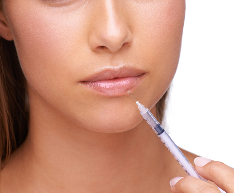 A young woman injecting her lip with botox